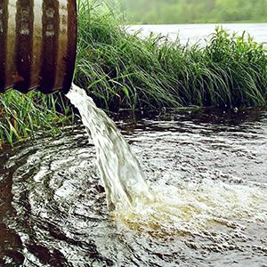 Water draining from a pipe into a lake or river by Workandapix on Pixabay.com
